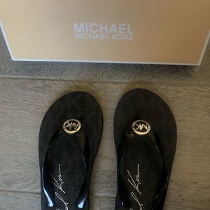 Black Micheal Kors Flip Flop  (US size 8)